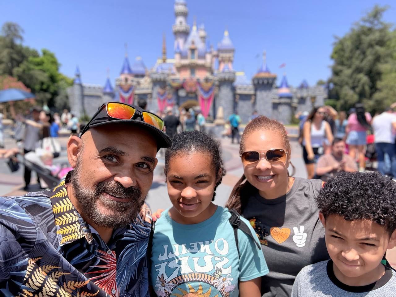 Darryl, Melissa, Olivia, and Nicholas in front of Sleeping Beauty Castle